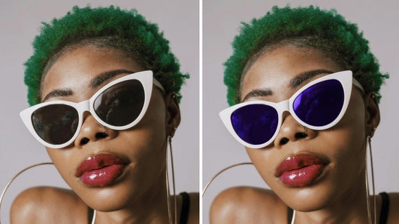Woman wearing sunglasses with lenses color-corrected from gray to blue using touch up paintbrush